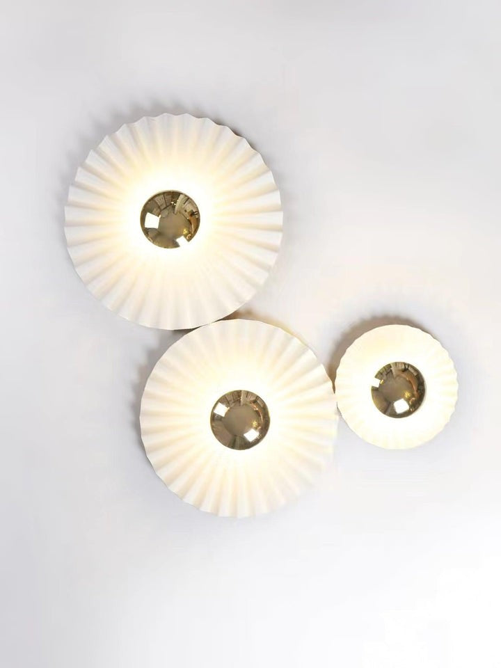 Glossy White & Gold Pleated Ceramic Wall Sconce with Integrated LED