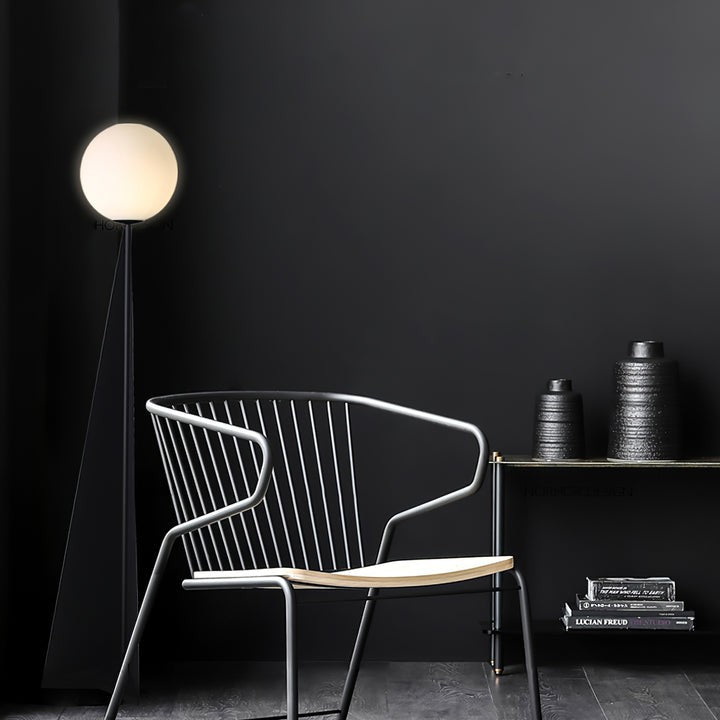Glowing Sphere Floor Lamp with Sleek Tapered Metal Base