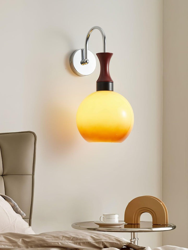 Golden Globe Wall Sconce with Sleek Metal Arm
