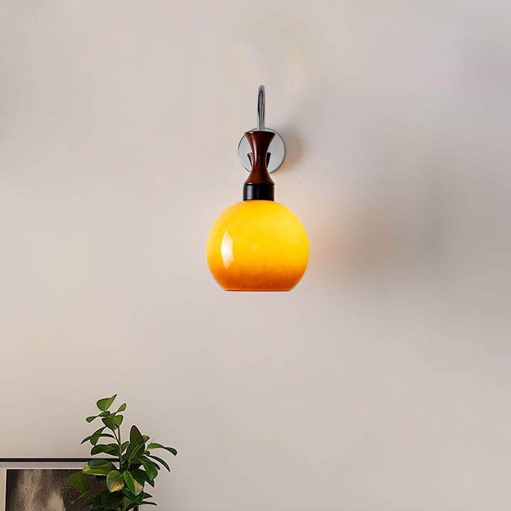 Golden Globe Wall Sconce with Sleek Metal Arm