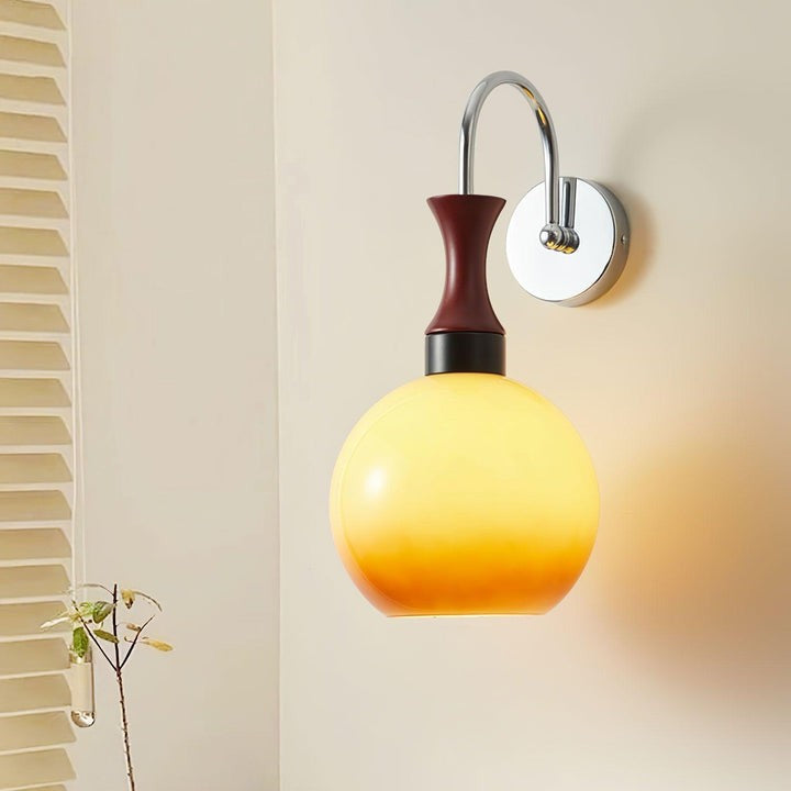Golden Globe Wall Sconce with Sleek Metal Arm