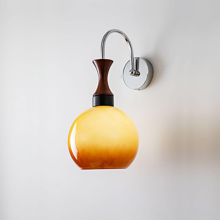 Golden Globe Wall Sconce with Sleek Metal Arm
