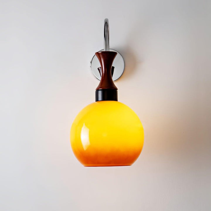 Golden Globe Wall Sconce with Sleek Metal Arm