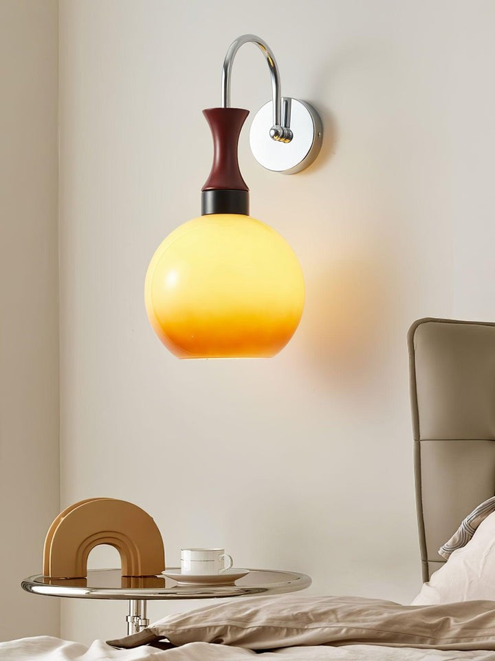 Golden Globe Wall Sconce with Sleek Metal Arm