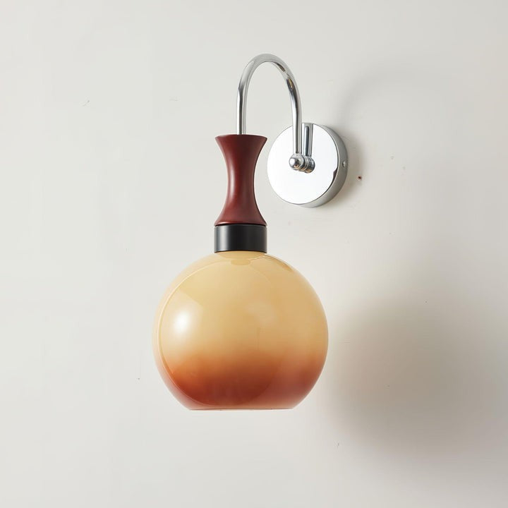 Golden Globe Wall Sconce with Sleek Metal Arm
