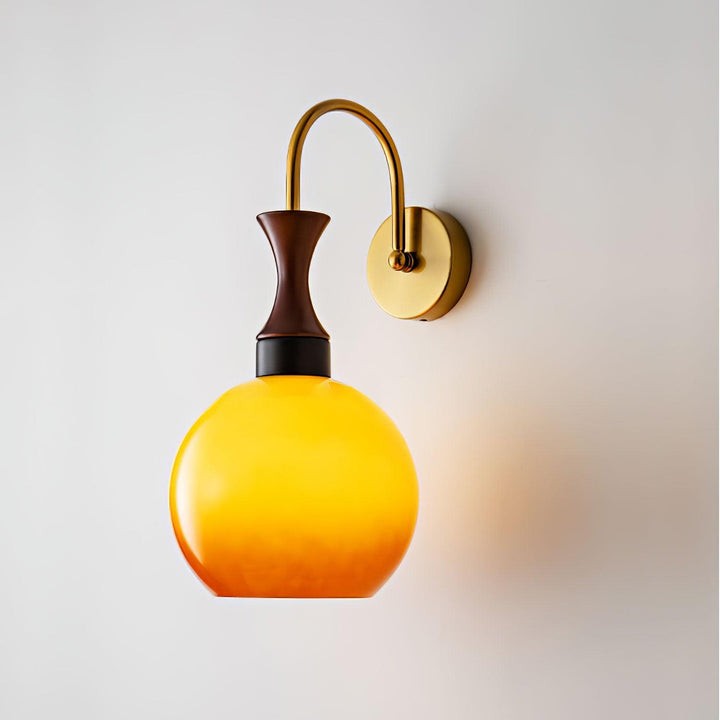 Golden Globe Wall Sconce with Sleek Metal Arm