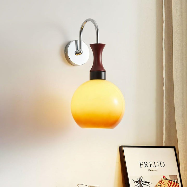 Golden Globe Wall Sconce with Sleek Metal Arm