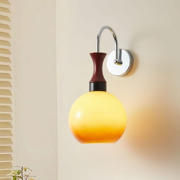 Golden Globe Wall Sconce with Sleek Metal Arm