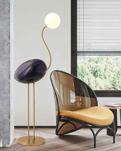 Flamingo-Inspired Gold Floor Lamp with Glass Orb