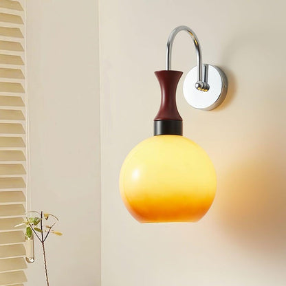 Golden Globe Wall Sconce with Sleek Metal Arm