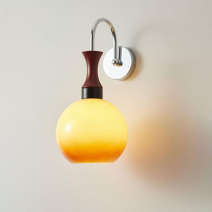Golden Globe Wall Sconce with Sleek Metal Arm