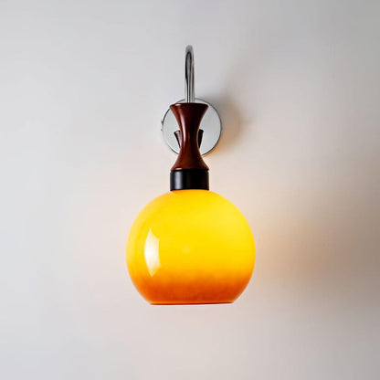 Golden Globe Wall Sconce with Sleek Metal Arm