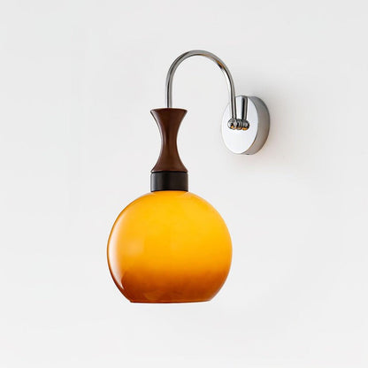 Golden Globe Wall Sconce with Sleek Metal Arm