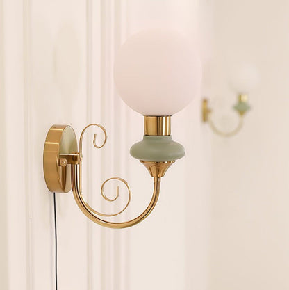 Plug-in Wall Sconce with Green Glass Shade and Gold Accents