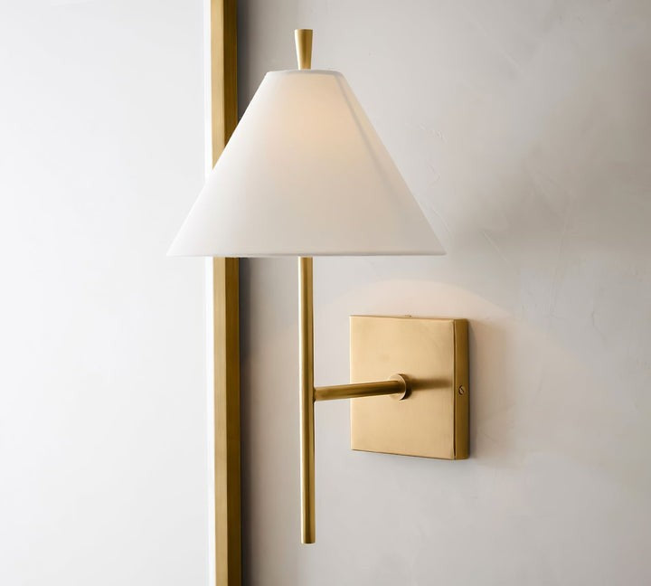 Sleek Brass Wall Sconce with White Shade & Ambient LED Lighting