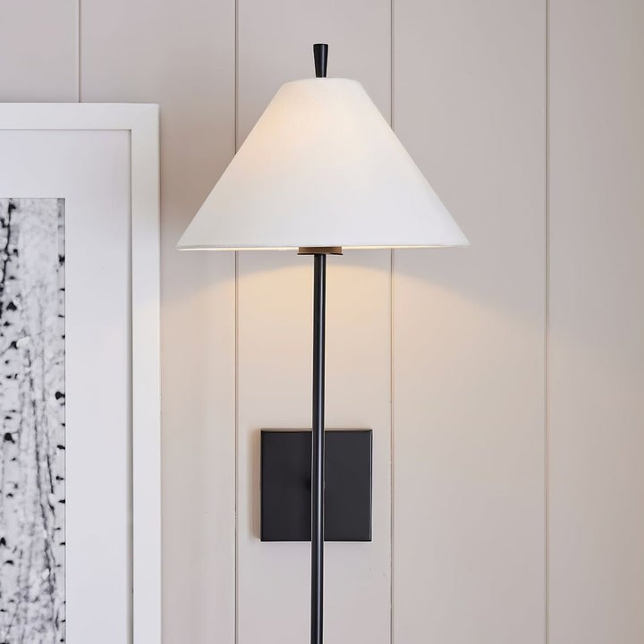 Sleek Brass Wall Sconce with White Shade & Ambient LED Lighting