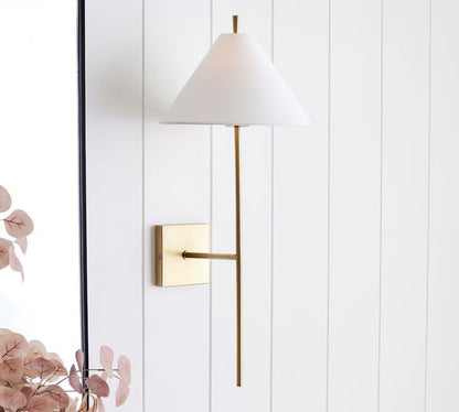 Sleek Brass Wall Sconce with White Shade & Ambient LED Lighting
