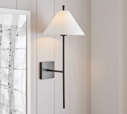 Sleek Brass Wall Sconce with White Shade & Ambient LED Lighting