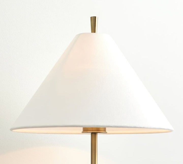 Sleek Brass Wall Sconce with White Shade & Ambient LED Lighting
