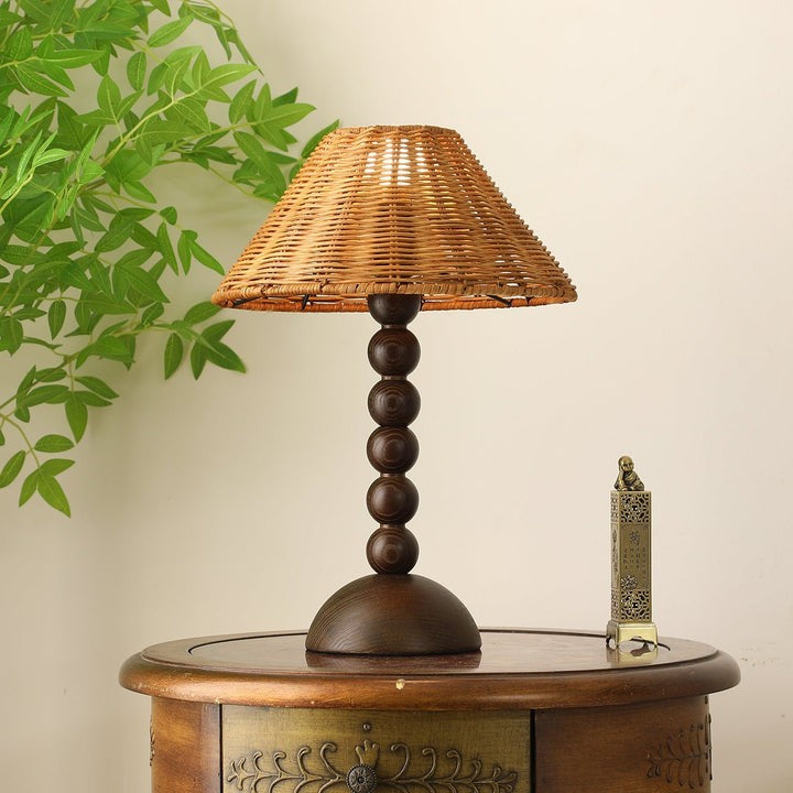 Wooden Table Lamp with Spherical Accents and Rattan Shade